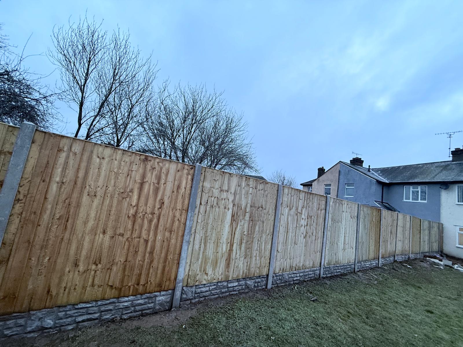 Alternative angle view of the completed featheredge fencing installation with concrete posts and gravel boards in Abington Park, Northampton by AAS Group Construction